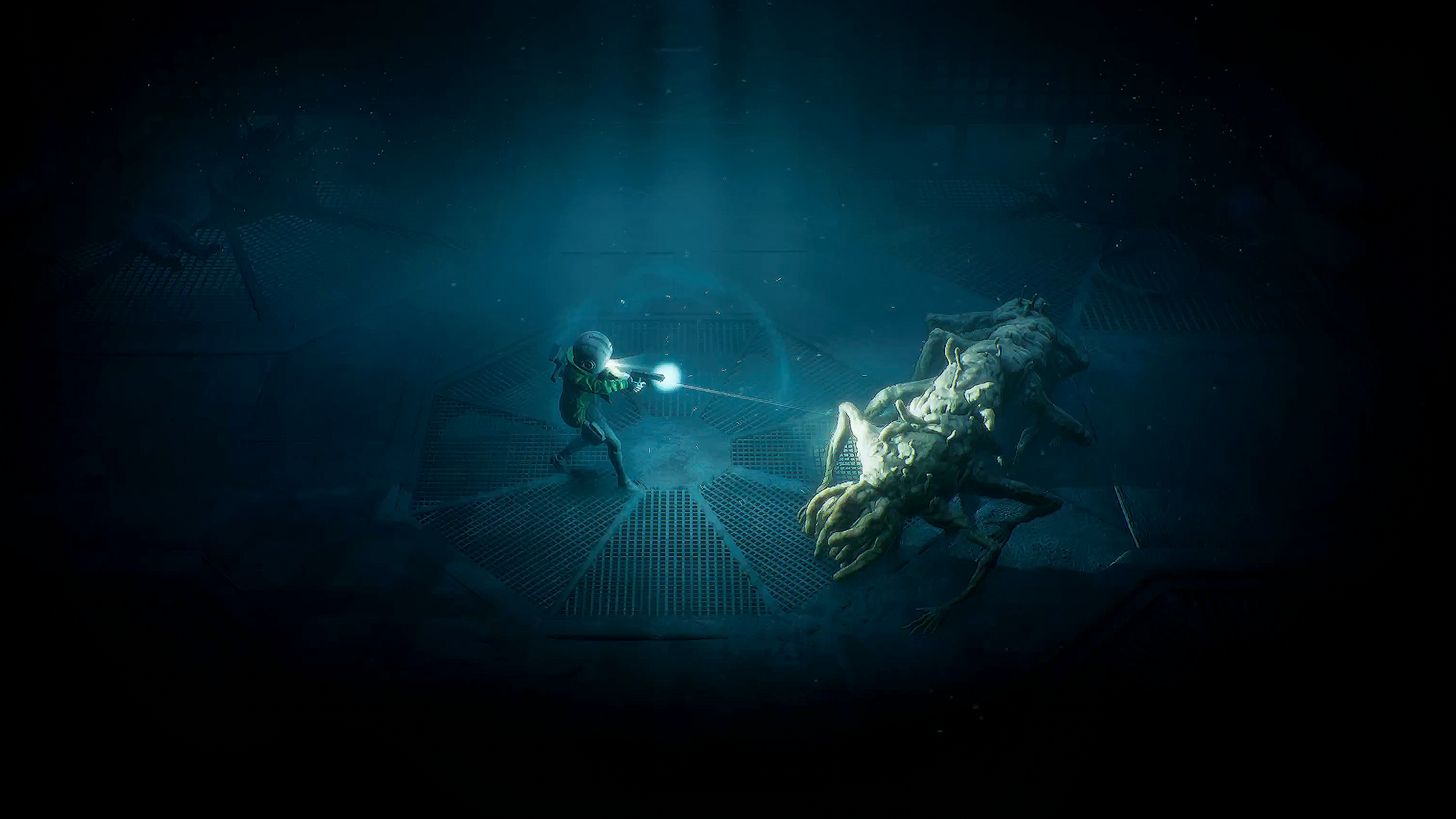 An armed explorer facing a creature inside the facility